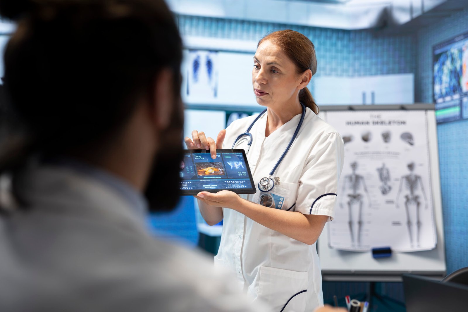 Doctor neurologist showing mri brain scan results to her colleagues, meeting in a cabinet to examine x rays and put a diagnostic. Analyzing tomography tests, neuroscience and radiology.
